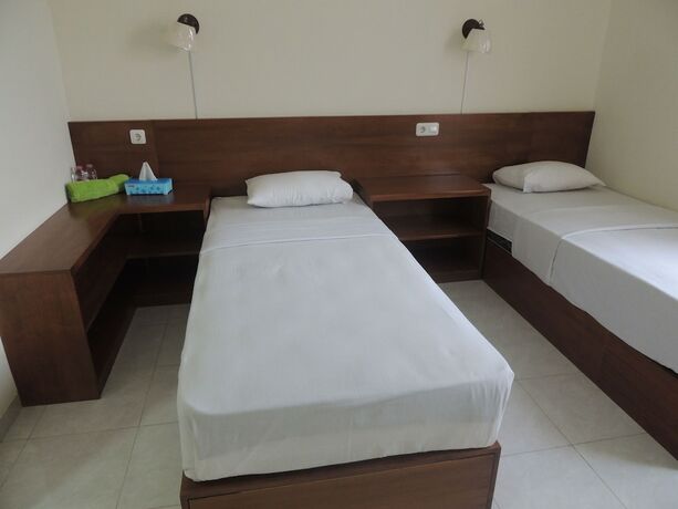 Imagen de la habitación del Hotel Wisma Tamu UKSW. Foto 17