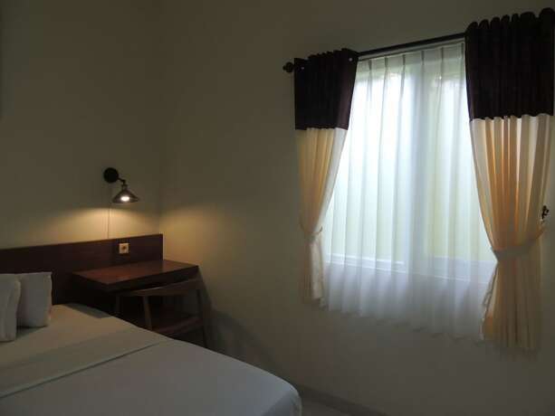 Imagen de la habitación del Hotel Wisma Tamu UKSW. Foto 19