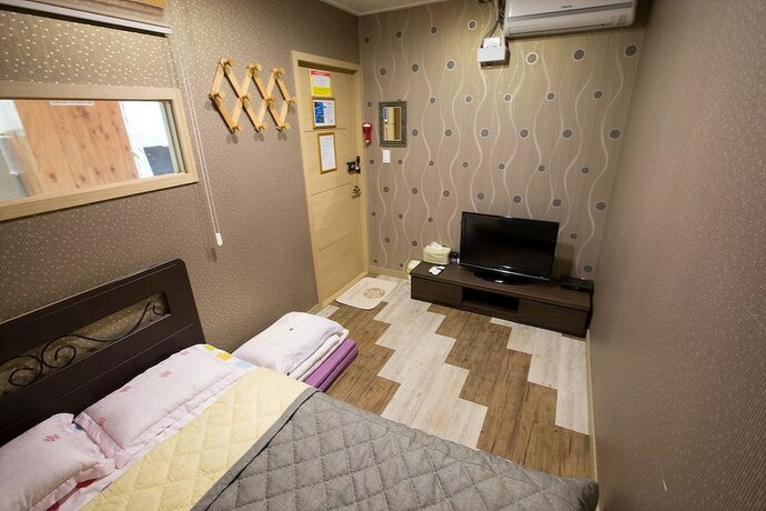 Imagen de la habitación del Hotel With Guesthouse. Foto 10