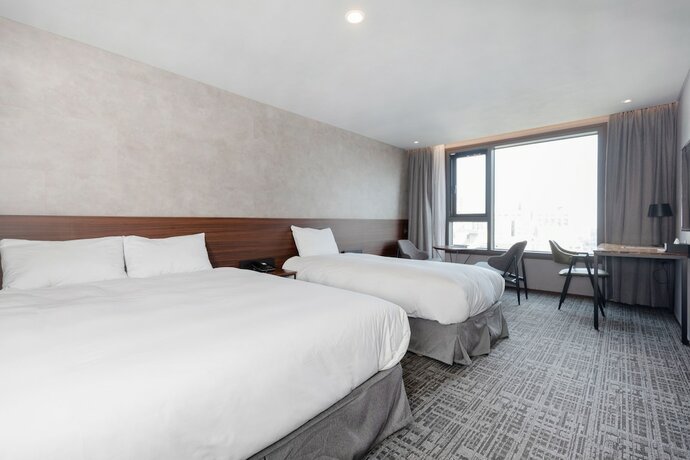 Imagen de la habitación del Hotel Withstay. Foto 17