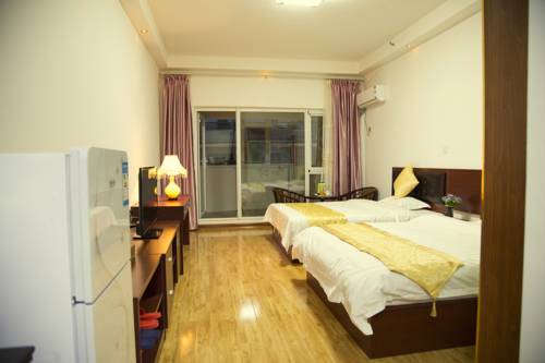 Imagen de la habitación del Hotel Wo Wei Renren Apartment. Foto 1