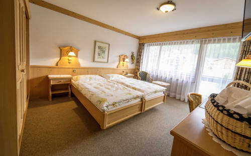 Imagen de la habitación del Hotel Wohlf&uuml;hlhotel Alpenhof. Foto 13