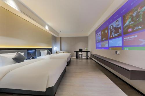 Imagen de la habitación del Hotel Wonderful Guangzhou Changlong Guangdi Garden Branch - Free Shuttle Bus to Canton Fair Complex. Foto 14