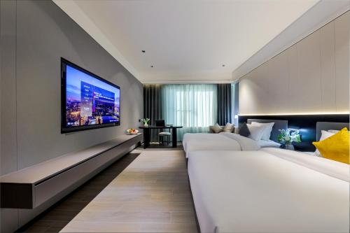 Imagen de la habitación del Hotel Wonderful Guangzhou Changlong Guangdi Garden Branch - Free Shuttle Bus to Canton Fair Complex. Foto 16