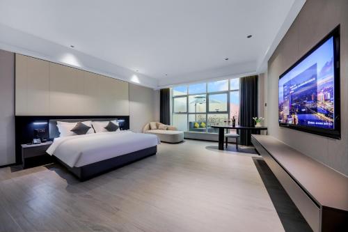 Imagen de la habitación del Hotel Wonderful Guangzhou Changlong Guangdi Garden Branch - Free Shuttle Bus to Canton Fair Complex. Foto 18