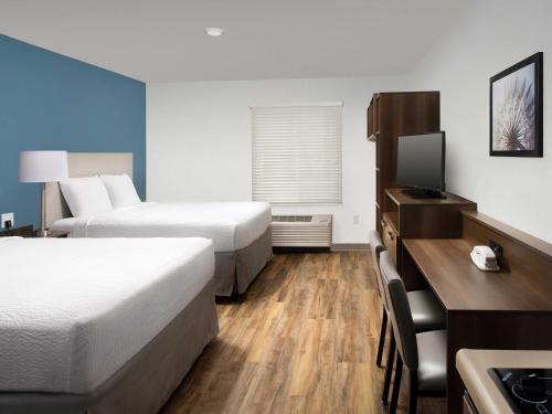 Imagen de la habitación del Hotel WoodSpring Suites Orlando Airport. Foto 9