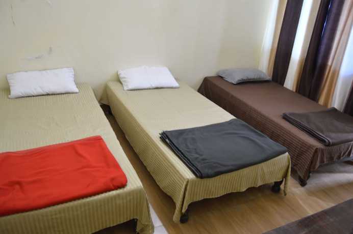 Imagen de la habitación del Hotel Wooden Umbrella. Foto 7