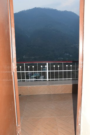 Imagen de la habitación del Hotel Wooden Umbrella. Foto 10