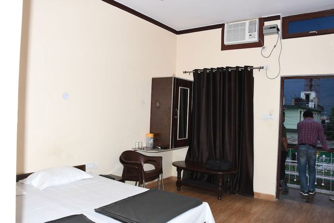 Imagen de la habitación del Hotel Wooden Umbrella. Foto 12