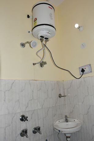 Imagen de la habitación del Hotel Wooden Umbrella. Foto 15