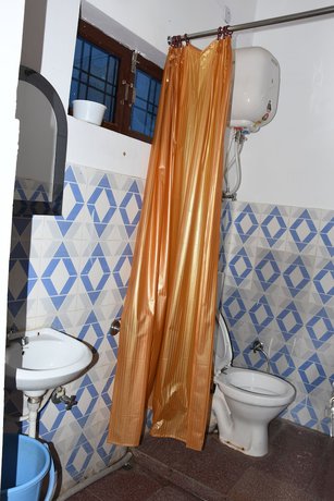 Imagen de la habitación del Hotel Wooden Umbrella. Foto 17