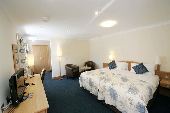 Imagen de la habitación del Hotel Woodland Bay. Foto 11