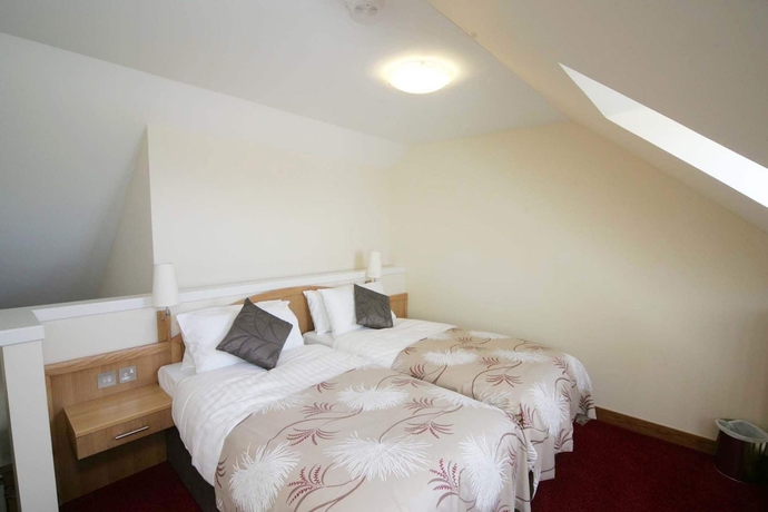 Imagen de la habitación del Hotel Woodland Bay. Foto 12