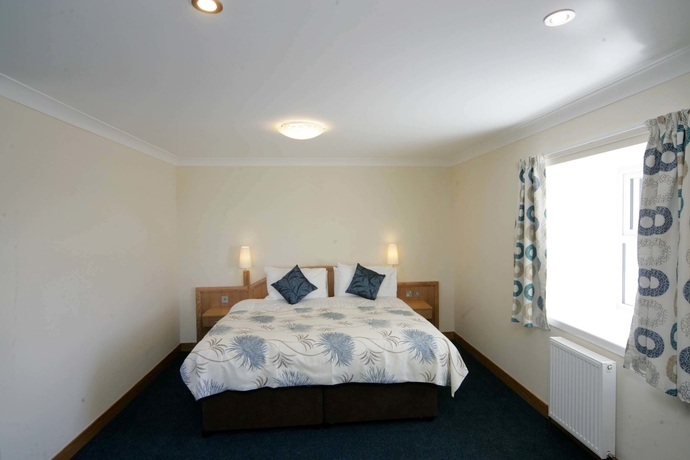 Imagen de la habitación del Hotel Woodland Bay. Foto 14