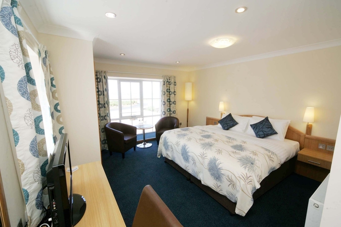 Imagen de la habitación del Hotel Woodland Bay. Foto 18