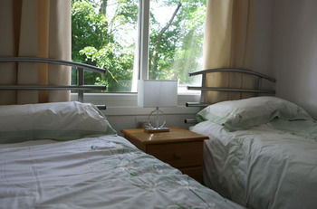 Imagen de la habitación del Hotel Woodland Lodge. Foto 10