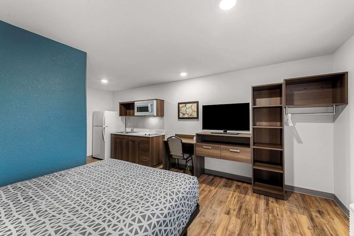 Imagen de la habitación del Hotel Woodspring Suites Kansas City Airport. Foto 11