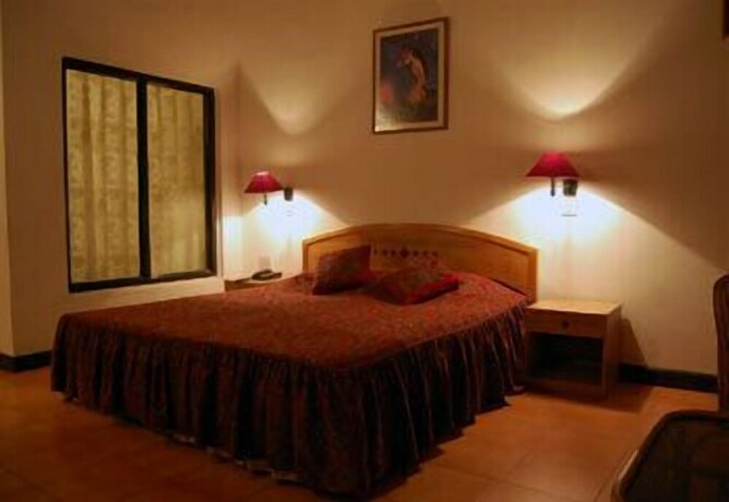Imagen de la habitación del Hotel Woodsvilla Residency. Foto 24