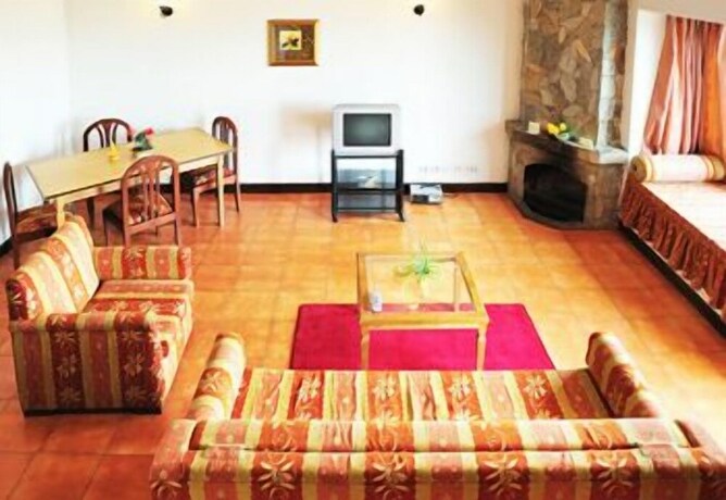 Imagen de la habitación del Hotel Woodsvilla Residency. Foto 26