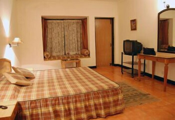 Imagen de la habitación del Hotel Woodsvilla Residency. Foto 27