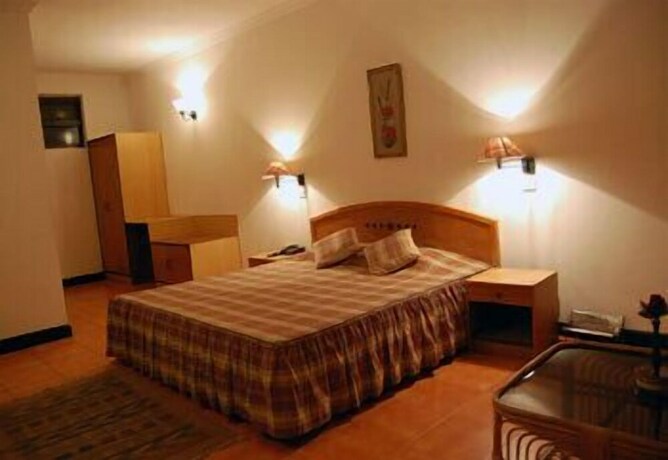 Imagen de la habitación del Hotel Woodsvilla Residency. Foto 28