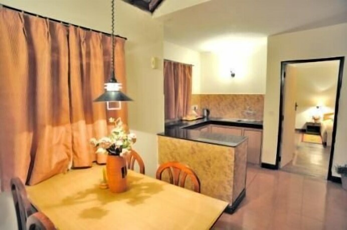 Imagen de la habitación del Hotel Woodsvilla Residency. Foto 30