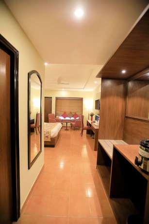Imagen de la habitación del Hotel Woodsvilla Resort. Foto 8