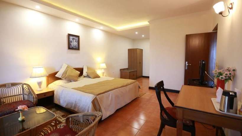 Imagen de la habitación del Hotel Woodsvilla Resort. Foto 12
