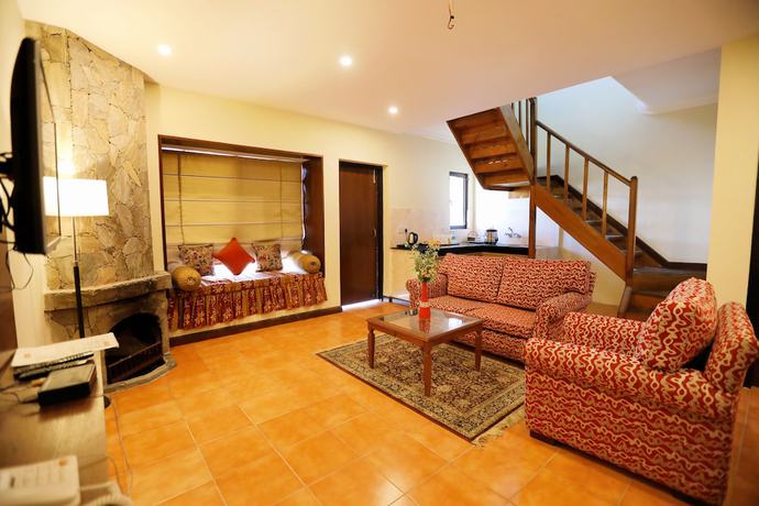 Imagen de la habitación del Hotel Woodsvilla Resort. Foto 13
