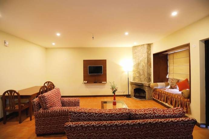 Imagen de la habitación del Hotel Woodsvilla Resort. Foto 14