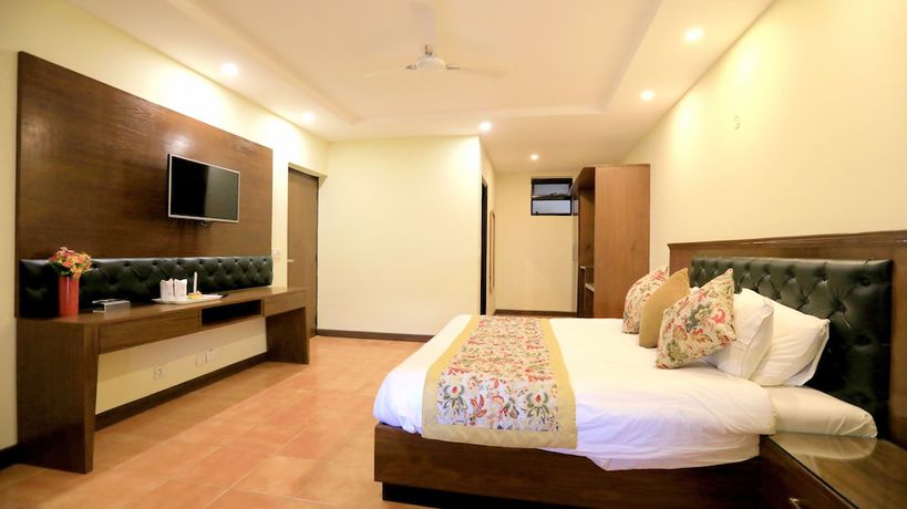 Imagen de la habitación del Hotel Woodsvilla Resort. Foto 16
