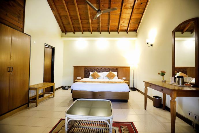 Imagen de la habitación del Hotel Woodsvilla Resort. Foto 17