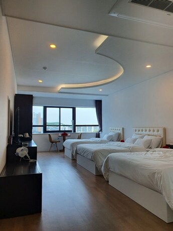Imagen de la habitación del Hotel Wooin. Foto 32