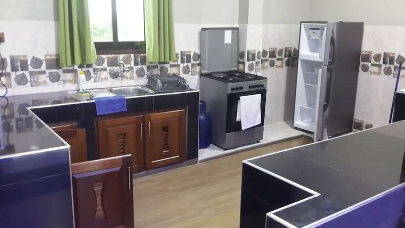 Imagen de la habitación del Hotel Woolsack Suites. Foto 9