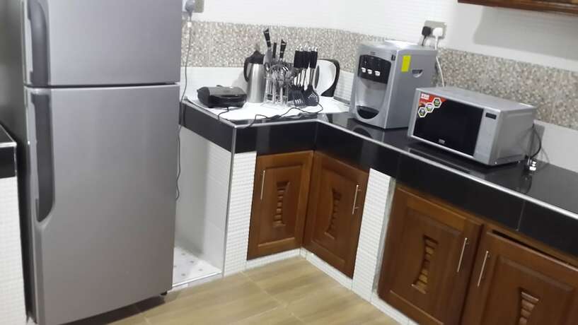 Imagen de la habitación del Hotel Woolsack Suites. Foto 10