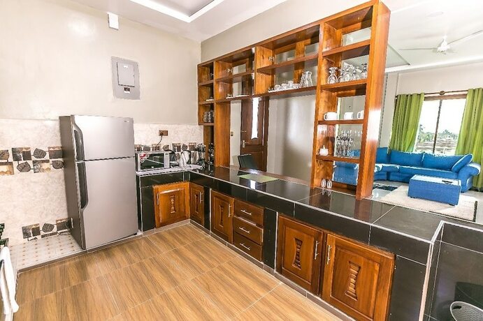 Imagen de la habitación del Hotel Woolsack Suites. Foto 11