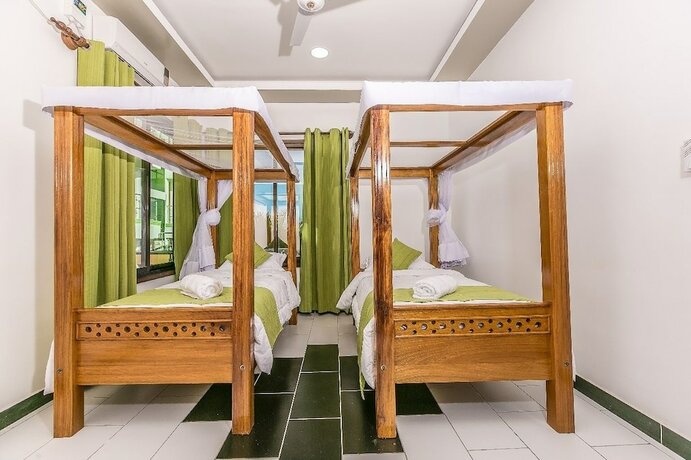 Imagen de la habitación del Hotel Woolsack Suites. Foto 12