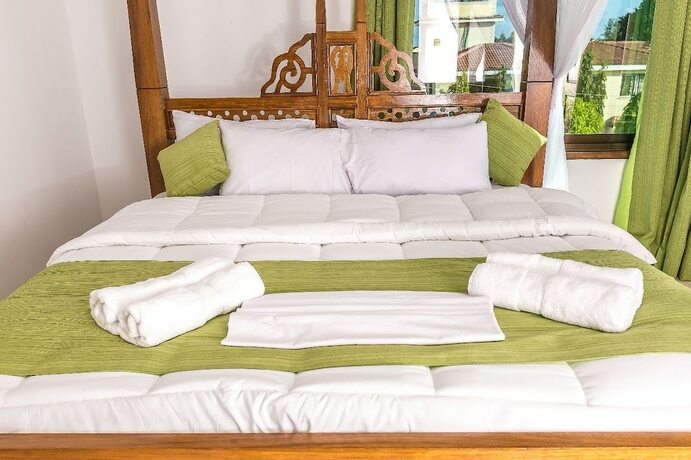 Imagen de la habitación del Hotel Woolsack Suites. Foto 13