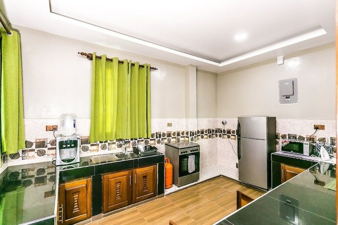 Imagen de la habitación del Hotel Woolsack Suites. Foto 14
