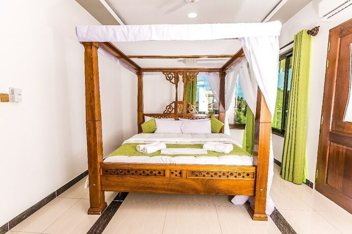 Imagen de la habitación del Hotel Woolsack Suites. Foto 15
