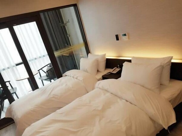 Imagen de la habitación del Hotel Wooyeon Flora. Foto 14