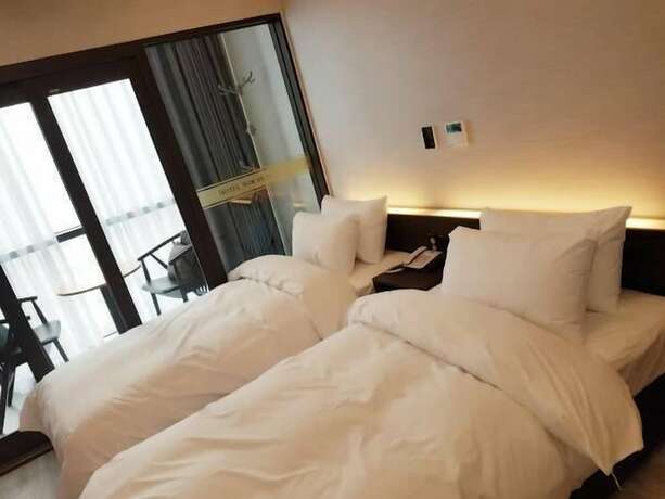 Imagen de la habitación del Hotel Wooyeon Flora. Foto 24