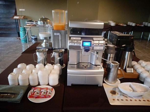 Imagen del bar/restaurante del Hotel Work Den Chiangrai. Foto 4