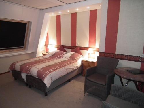 Imagen de la habitación del Hotel Workum. Foto 9
