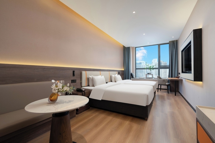 Imagen de la habitación del Hotel World Jinan CBD MixC Branch. Foto 1