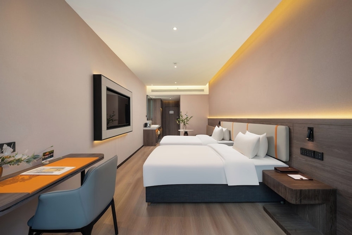 Imagen de la habitación del Hotel World Jinan CBD MixC Branch. Foto 2