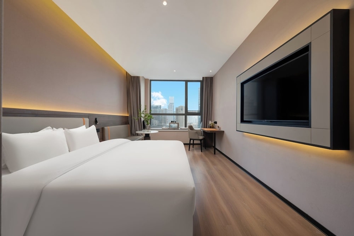Imagen de la habitación del Hotel World Jinan CBD MixC Branch. Foto 8