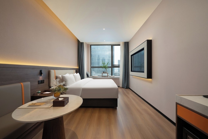 Imagen de la habitación del Hotel World Jinan CBD MixC Branch. Foto 9