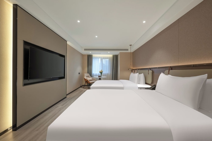 Imagen de la habitación del Hotel World Jinan Wenlvcheng Branch. Foto 6