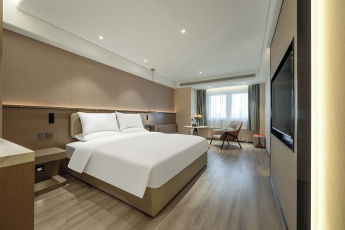 Imagen de la habitación del Hotel World Jinan Wenlvcheng Branch. Foto 8